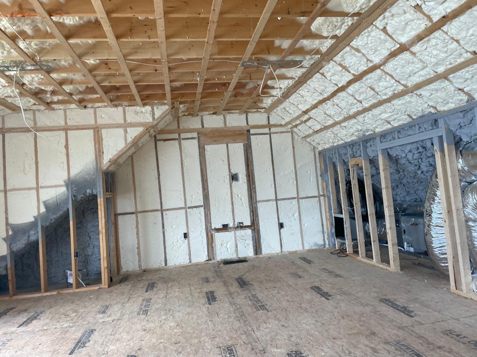 Spray foam covering studs